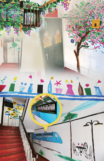 近日,记者看到双江社区玉兰新村21幢1单元的整个楼道被画满了一幅幅